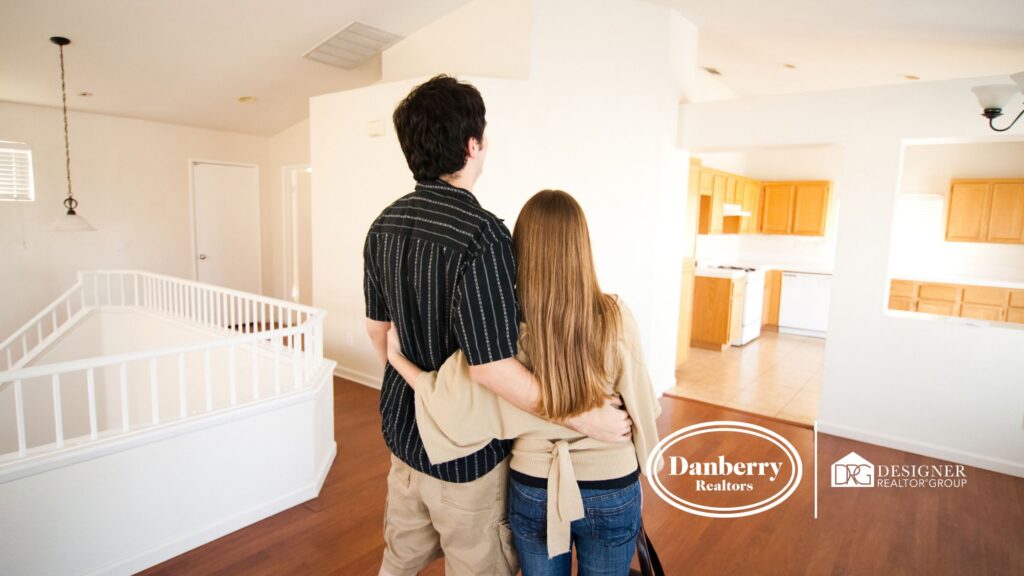Couple viewing home interior before selling in Findlay, Ohio